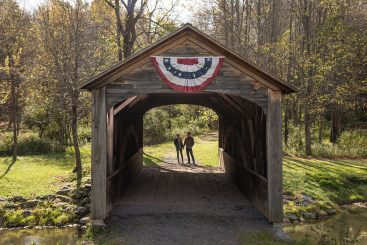 A couple amid Cooperstown Fall Foliage