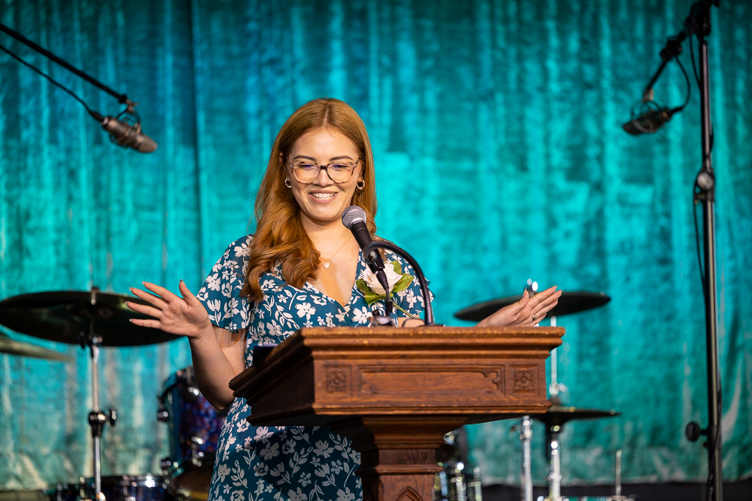 Silvia speaking at a podium
