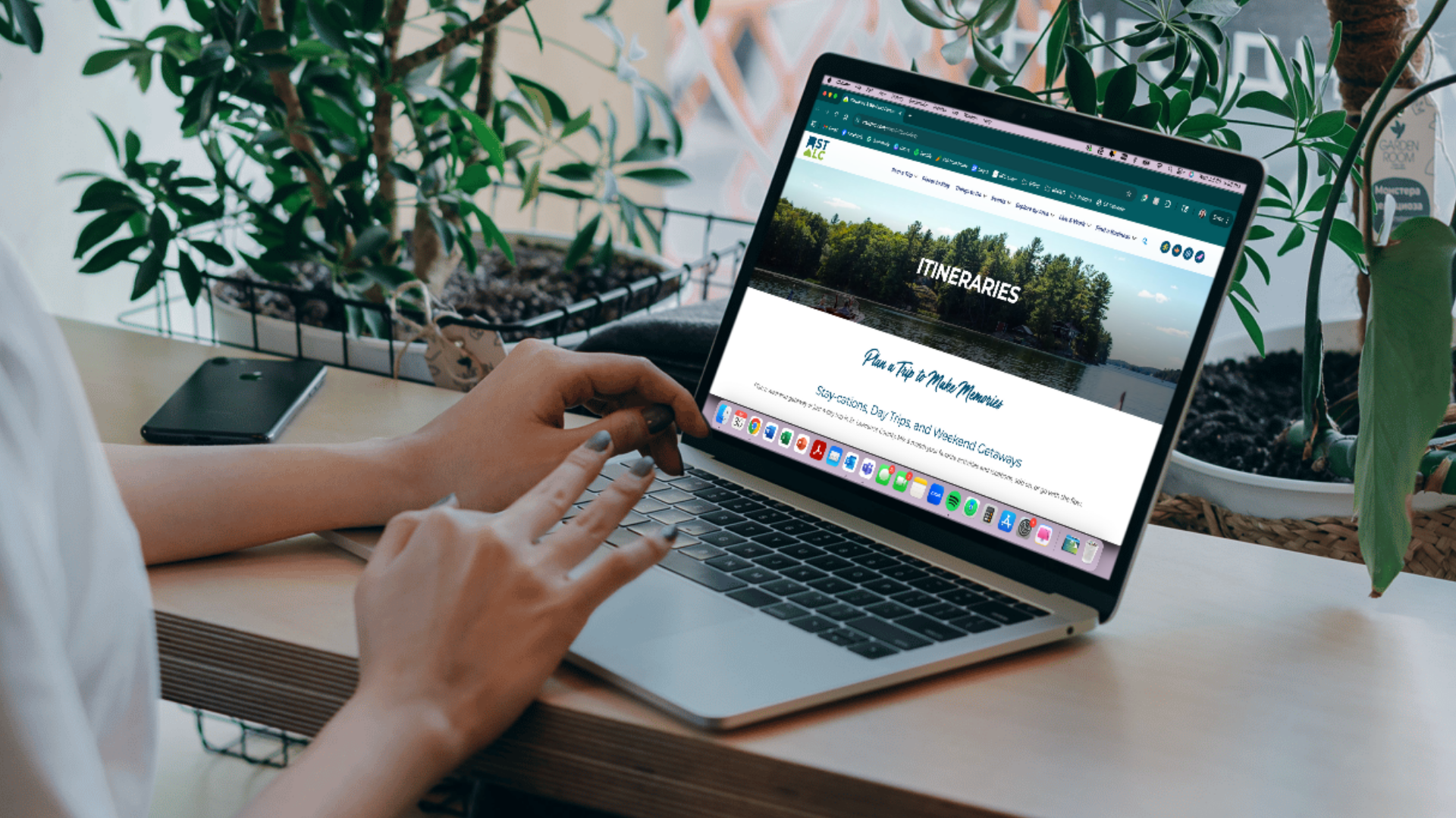 woman on computer looking at a tourism itinerary